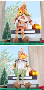 Close-up of fall gnomes with sunflowers, maple leaves and orange plaid details