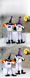 Macro shot of Halloween ghost plush dolls with wizard hats and striped long legs