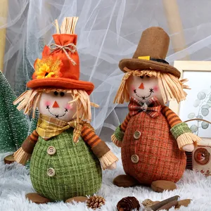Fall harvest sunflower scarecrow dolls with maple leaf hats for Thanksgiving decor
