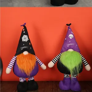 Close-up of Halloween gnomes with black spiderweb and purple skull hats for home decor
