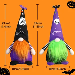 Detailed size view of two Halloween gnomes with spider and skull hats on orange background