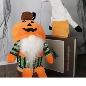 Macro detail of Halloween gnome plush featuring pumpkin hat and striped sequin fabric