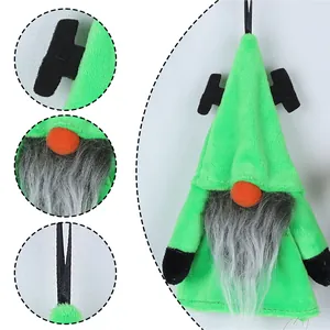Detail of Halloween gnome plush with green faux fur, grey beard, and orange nose