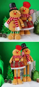 Detail of plush gingerbread couple with adjustable telescopic legs and festive outfits