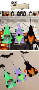 Three Halloween plush gnome hangers in green, purple, and black with bat ears on a fireplace