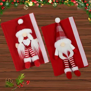 Christmas gnome handle covers set of 2 with red felt and striped legs on wooden background