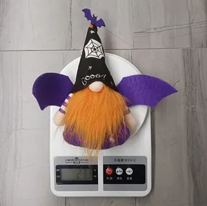 Detail showing a Halloween gnome with bat wings being weighed on a digital scale