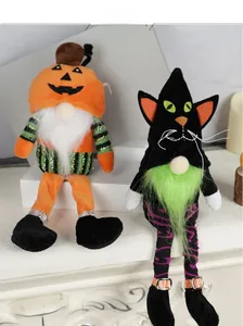 Macro shot of Halloween gnome plush dolls featuring pumpkin head and black cat designs