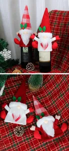 Detail of Christmas gnome wine bottle covers in red and white plaid knit with plush beards