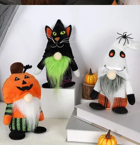 Close-up of Halloween gnomes featuring pumpkin, black cat, and ghost designs on a white stand