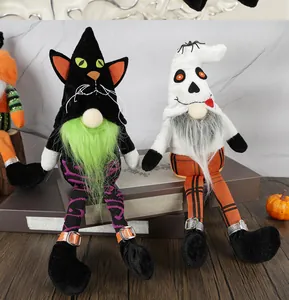 Detail of Halloween gnome dolls with black cat and skeleton motifs on striped long legs