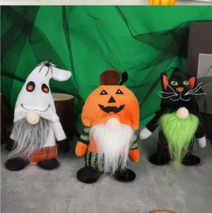 Detail view of Halloween gnome plush trio featuring ghost, pumpkin and black cat themes