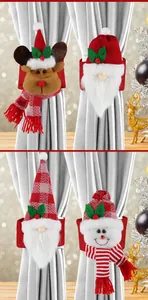 Dettaglio dei fermatende natalizi in peluche con Babbo Natale, Renna e Pupazzo di neve
