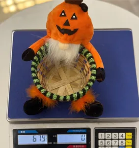Halloween gnome pumpkin woven basket shown on scale with 67.9g weight measurement