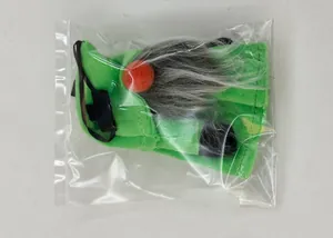 Macro shot of St. Patrick's Day green plush gnome hanging ornament in clear packaging