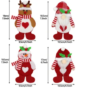 Close-up of four Christmas cutlery holders with detailed size labels and festive designs