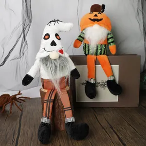 Halloween gnome set with skull cloak and pumpkin hat on a festive wooden surface