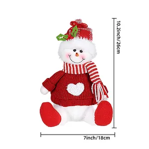 Christmas snowman plush doll in red knit sweater with striped scarf decoration