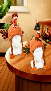 Close-up of Thanksgiving plush turkey hats featuring warm orange tones and festive long legs