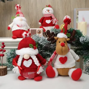 Christmas plush dolls set featuring gnomes, snowman and reindeer on wooden background