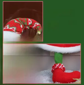 Detail of red and green knitted Christmas elf with plush trim and small golden bells