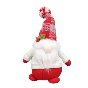 Christmas gnome plush with red plaid knit hat and holly berry decoration on white background
