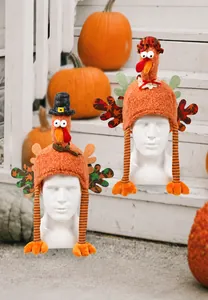 Detail of plush turkey hats with striped long legs and autumn maple leaf wing patterns
