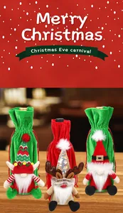 Detailed view of three festive Christmas wine bottle covers with gnome and reindeer motifs