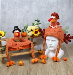 Detail of plush Thanksgiving turkey hats with long striped legs and fall floral decor
