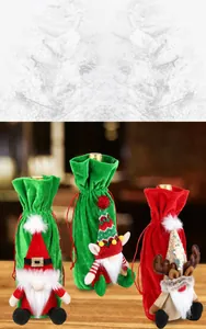 Detailed view of red and green velvet Christmas wine bottle covers with gnome and reindeer