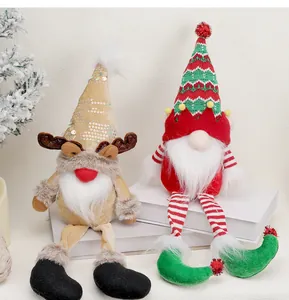 Detail of Christmas gnomes with long legs and sequined reindeer antlers for holiday decor