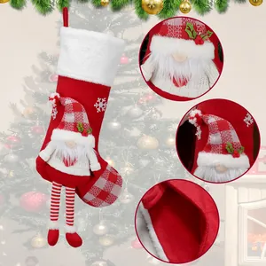 Large Christmas stocking with plush gnome and red-white checkered hat for holiday decoration