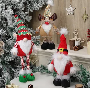 Close-up of three festive Christmas gnomes with sequined hats and long legs decor