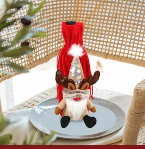Detail of Christmas wine bottle cover featuring a red gnome with sequin hat and elk antlers