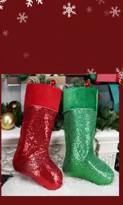 Detail of sequined Christmas stockings in red and green on a cozy white mantel decor