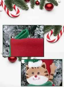 Close-up of a festive Christmas stocking with cartoon cat embroidery and soft fur trim