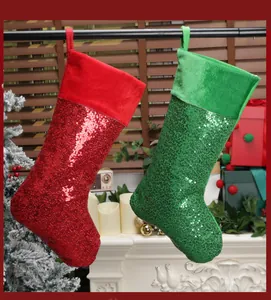 Close-up of sparkling red and green sequined Christmas stockings on a cozy fireplace mantle