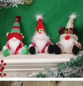 Detailed view of three festive Christmas gnomes with knit hats, sequins, and reindeer antlers