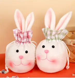 Detail of plush Easter bunny candy bags with long ears and colorful drawstring closures
