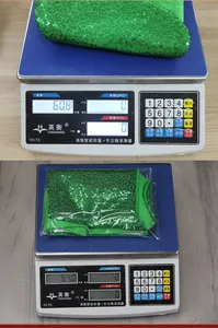 Weight detail showing a green sequined Christmas stocking on a digital scale