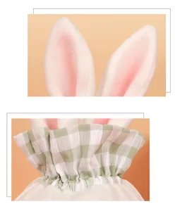 Detail of plush bunny ears and green gingham fabric on a drawstring Easter candy gift bag