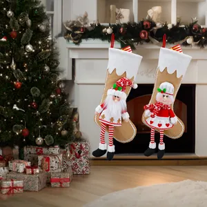 Set of two Christmas stockings with 3D gnome and chef girl figures on festive fireplace