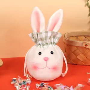 Detail of plush Easter bunny candy bag with long ears and green checkered drawstring