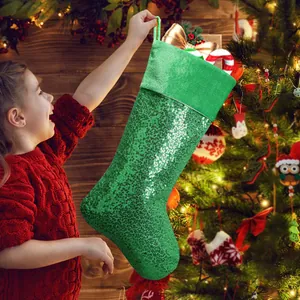 Sparkling green sequin Christmas stocking for festive fireplace and holiday tree decoration