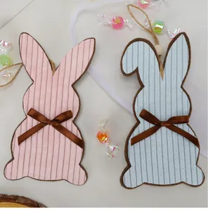 Detail of Easter bunny fabric pendants with corduroy texture and wooden beads
