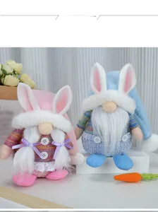 Detail of pink and blue Easter faceless gnomes with long braids and checkered overalls