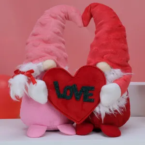Pair of Valentine's Day faceless gnomes holding a red heart with LOVE message