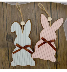 Detailed view of striped corduroy Easter bunny hanging ornaments with wood beads.