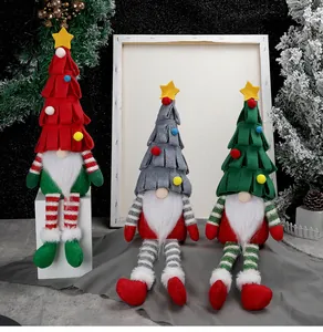 Detailed view of three festive Christmas gnomes with tree hats and striped long legs