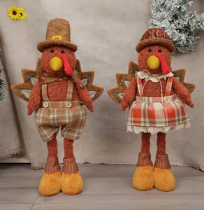 Detail of harvest turkey plush dolls with knit fabric and check patterns for fall decor